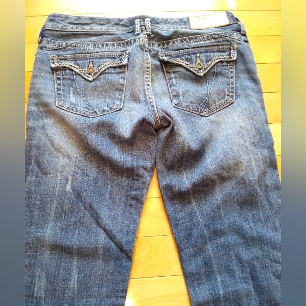 Express boot cut jeans with whisker stitching embellished pockets, size 4.